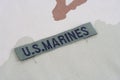 US MARINES branch tape with dog tags on desert camouflage uniform Royalty Free Stock Photo