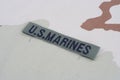 US MARINES branch tape with dog tags on desert camouflage uniform