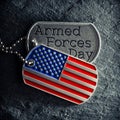 US military soldier\'s dog tags engraved with Armed Forces Day text Royalty Free Stock Photo