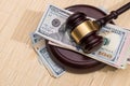 us money with wooden judges hammer on table