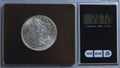 US Morgan silver dollar being weighed on digital scale Royalty Free Stock Photo