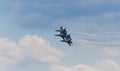 The US Navy Blue Angels Fly in Formation Across the Clouds in the Sky Royalty Free Stock Photo