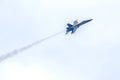 US Navy Blue Angels Hornet Fighter Jet Flying Up In The Sky With Smaoke Trail Royalty Free Stock Photo