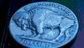 US nickel. Coin 5 cents close-up. Blue tinted pasteurization illustration with American bison. Buffalo nickel. News about USA Royalty Free Stock Photo