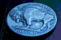 US nickel. Coin 5 cents closeup. Blue tinted pasteurization illustration with American bison. Buffalo nickel. News about USA Royalty Free Stock Photo