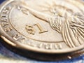 US one dollar coin close-up. Bright expressive illustration about American money, finance, debt market. USA economy news. Macro Royalty Free Stock Photo