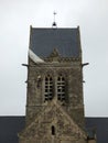 US Paratrooper dummy hanging from church tower to remember 82nd division airborne operations beginning of D-Day landings in Norman