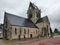 US Paratrooper dummy hanging from church tower to remember 82nd division airborne operations beginning of D-Day landings in Norman