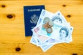 US passport and British money on a table Royalty Free Stock Photo