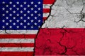 US and Poland flag on textured cracked ground. The concept of cooperation between the two countries. 3d rendering