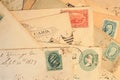 Antique mail with hand cancelled stamps and cachet on yellowed envelopes Royalty Free Stock Photo