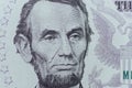 US President Abraham Lincoln face on five dollar bill macro, 5 u Royalty Free Stock Photo