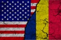 US and Romania flag on textured cracked ground. The concept of cooperation between the two countries. 3d rendering Royalty Free Stock Photo