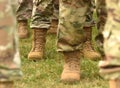 US soldiers legs in green camouflage military uniform. US troops