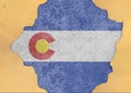 US state Colorado flag painted on concrete hole and cracked wall Royalty Free Stock Photo