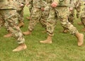 US troops. Soldiers marching on green grass. US Army Royalty Free Stock Photo