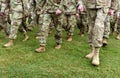 US troops. Soldiers marching on green grass. US Army