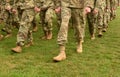 US troops. Soldiers marching on green grass. US Army Royalty Free Stock Photo