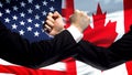 US vs Canada confrontation, countries disagreement, fists on flag background