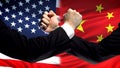 US vs China confrontation, countries disagreement, fists on flag background