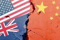 US (United States), New Zealand, China national flag isolated on broken wall background