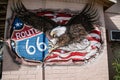 USA American flag with eagle symbol of the United States on a route 66 wall Royalty Free Stock Photo