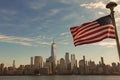 USA American flag. Memorial Day, Veteran's Day, July 4th. American Flag Waving near New York City, Manhattan view Royalty Free Stock Photo