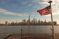 USA American flag. Memorial Day, Veteran's Day, July 4th. American Flag Waving near New York City, Manhattan view Royalty Free Stock Photo