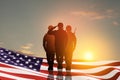 USA army soldiers saluting with nation flag. Greeting card for Veterans Day, Memorial Day, Independence Day. Royalty Free Stock Photo