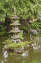 Stone pagoda style statue in pond, Japanese Garden, San Francisco, CA, USA Royalty Free Stock Photo