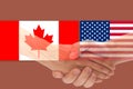 USA and Canada flag with handshake