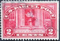 USA - Circa 1912 : a postage stamp printed in the US showing a city carrier delivers consignments Text: US Parcel Post