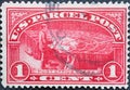 USA - Circa 1912 : a postage stamp printed in the US showing a post office clerk sorts mail. Text: US Parcel Post