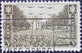 USA - Circa 1945: a postage stamp printed in the US showing .a procession of troops in front of the Arc de Triomphe in Paris as si