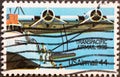 USA - Circa 1985 : a postage stamp printed in the US showing a propeller plane with wings and two engines that is loaded. The Chin