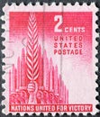 USA - Circa 1943: a postage stamp printed in the US showing raised swords behind an uplifted palm branch of peace. Text: Nations U