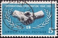 USA - Circa 1965 : a postage stamp printed in the US showing Shaking hands in the laurel branch United Nations UN Text: Internatio