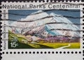 USA - Circa 1972 : a postage stamp printed in the US showing a spectacular mountain with reindeer. Text: National Parks Centennial