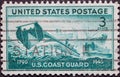 USA - Circa 1945: a postage stamp printed in the US showing two coast guard landing crafts with a supply ship in the background. U