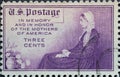 USA - Circa 1934: a postage stamp printed in the US showing a woman in traditional Mothers of America dress. Text: In memory and h