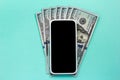 USA currency. Dollars. Blank smartphone screen and cash bills on