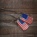 USA dog tags on wooden background Royalty Free Stock Photo