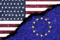 USA and EU flag print screen on wall crack.It is symbol of economic tariffs trade war and tax barrier conflict between United Royalty Free Stock Photo