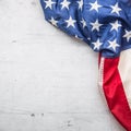 USA flag. American flag. Top of view American flag freely lying on white concrete background. Close-up Studio shot Royalty Free Stock Photo