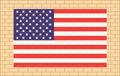 USA flag on beige brick wall