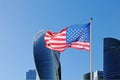 Usa flag fluttering on flagpole against the background of Moscow City Royalty Free Stock Photo