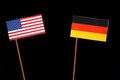 USA flag with German flag on black Royalty Free Stock Photo