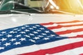 USA flag on the hood of a white car Royalty Free Stock Photo