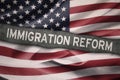 USA flag with Immigration Reform word Royalty Free Stock Photo