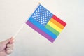 USA flag and flag of LGBT community. problem of rights of sexual minorities in country. non-traditional relations and politics